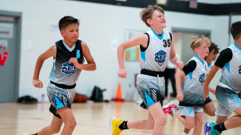 two youth basketball players in Omaha playing basketball